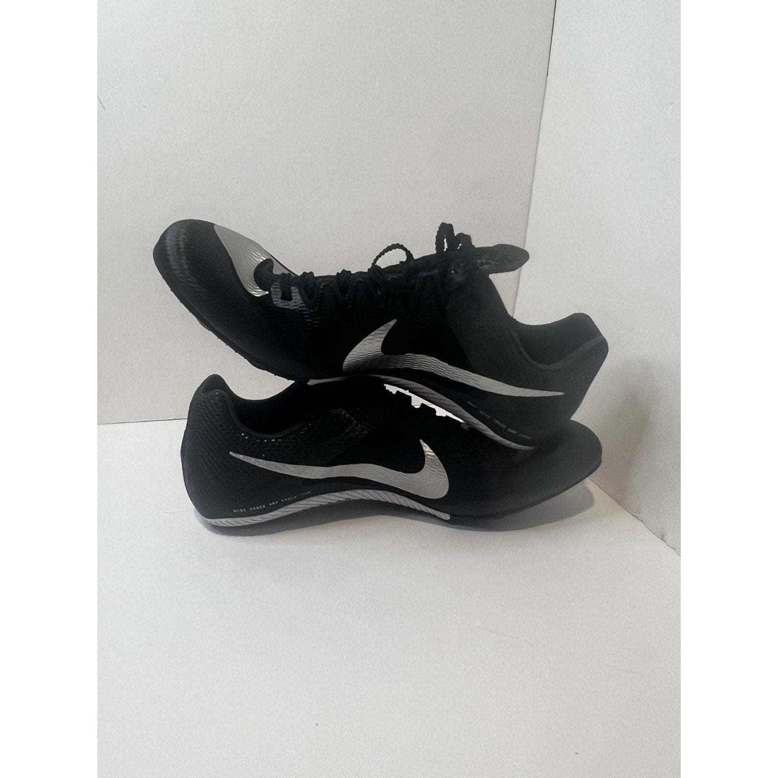 Size 9.5 Mens- Nike track shoes